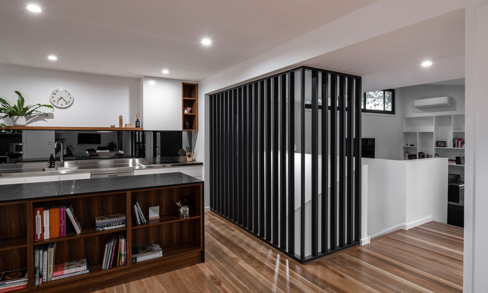 Dark tones throughout a modern home extension